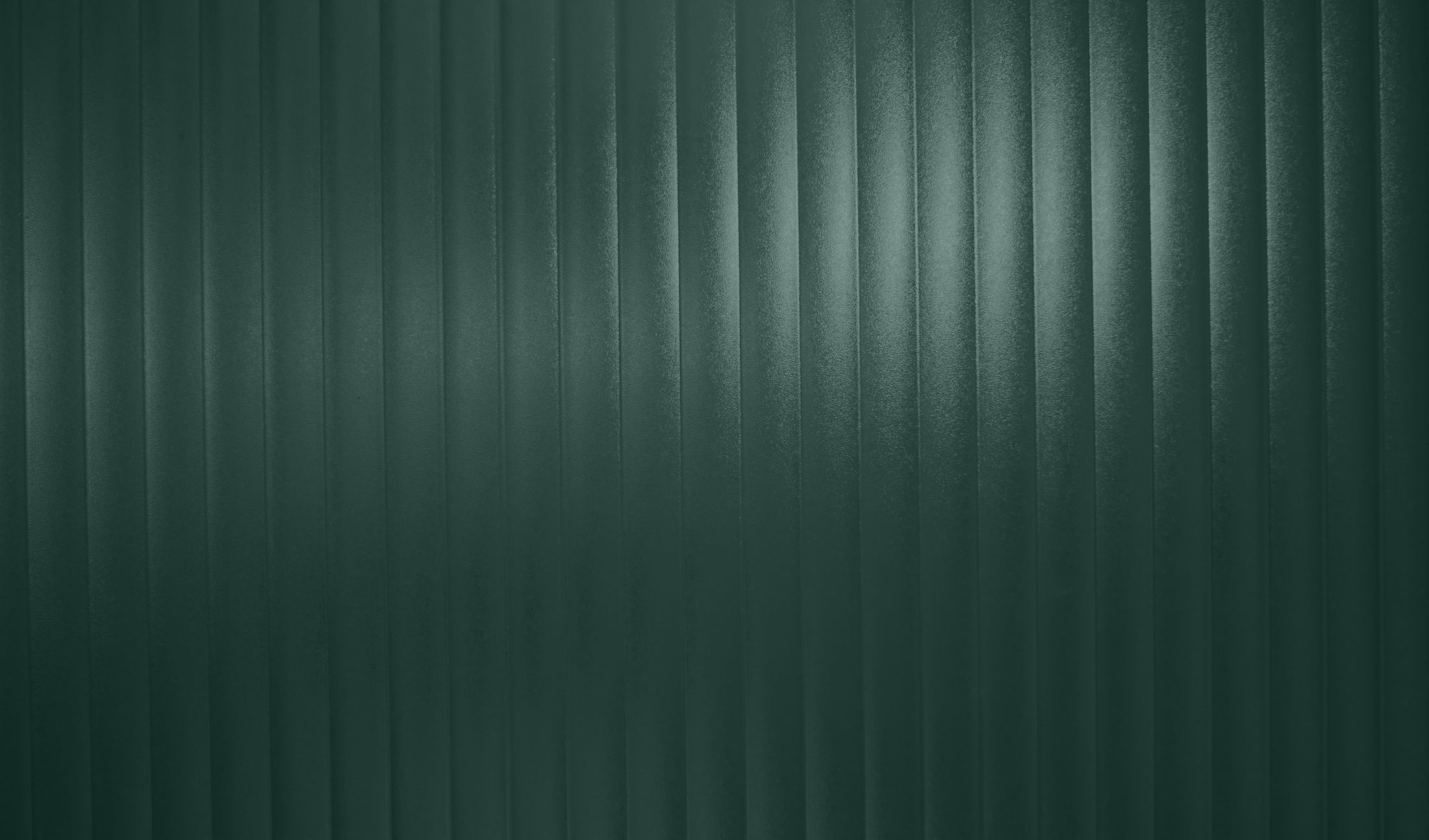 Textured dark green vertical stripes background.