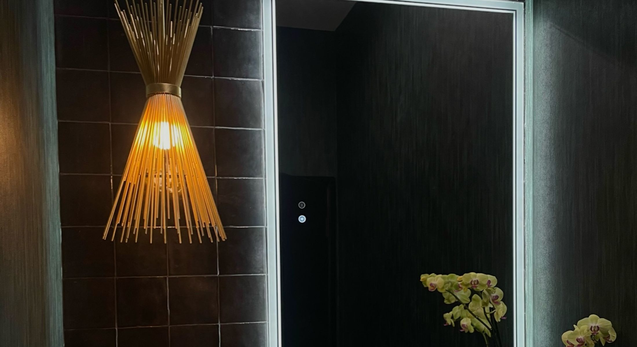 Modern interior with decorative lamp and orchids.