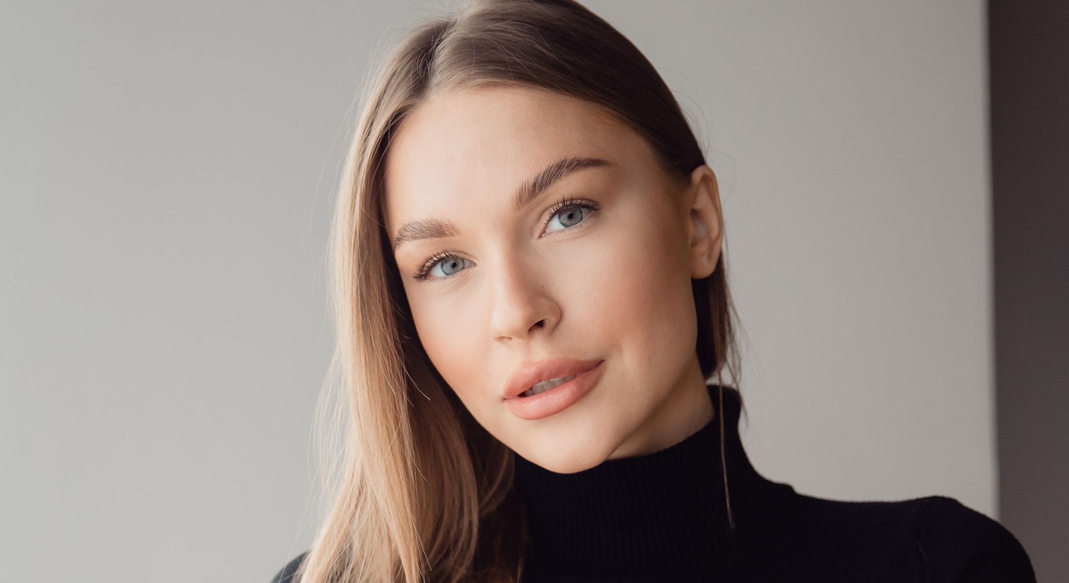 Close-up portrait of a woman with long hair.