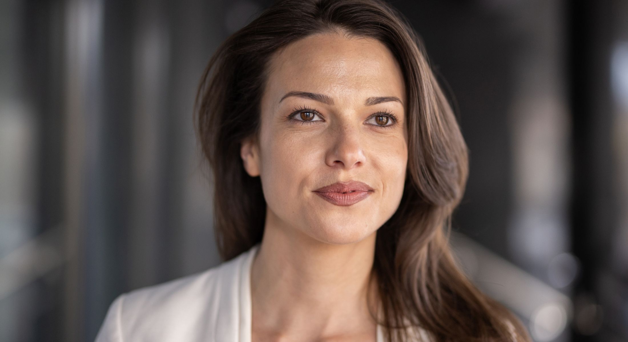 Mission Viejo hair removal model with brown hair and confident expression.