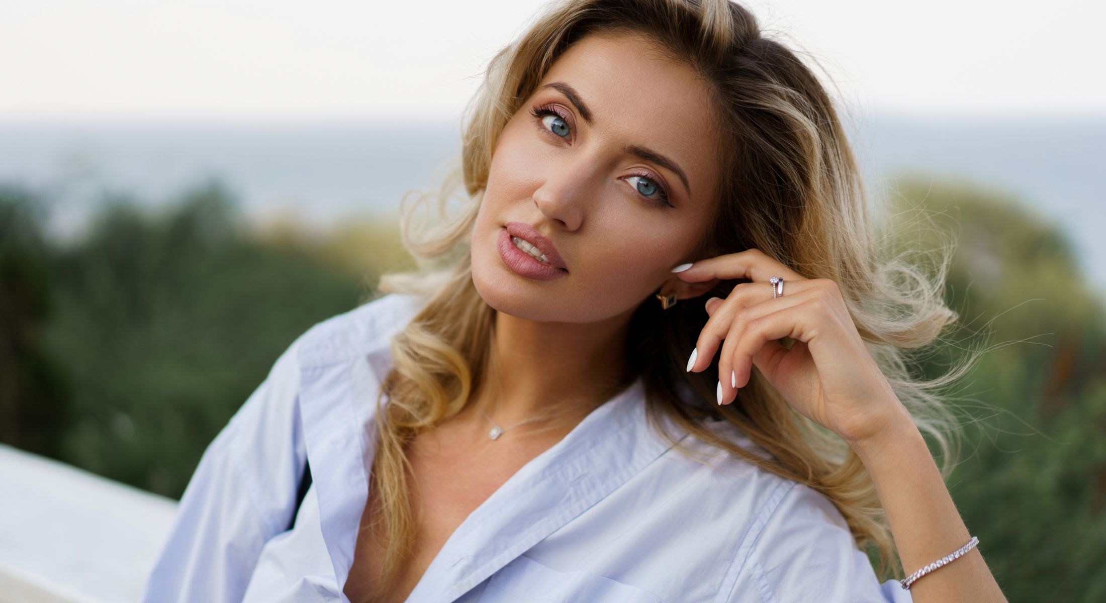 Mission Viejo skin resurfacing model with blond hair posing outdoors.